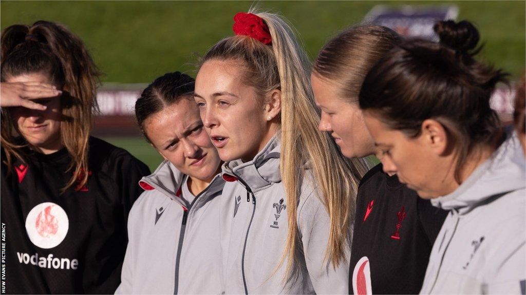 Hannah Jones in team huddle