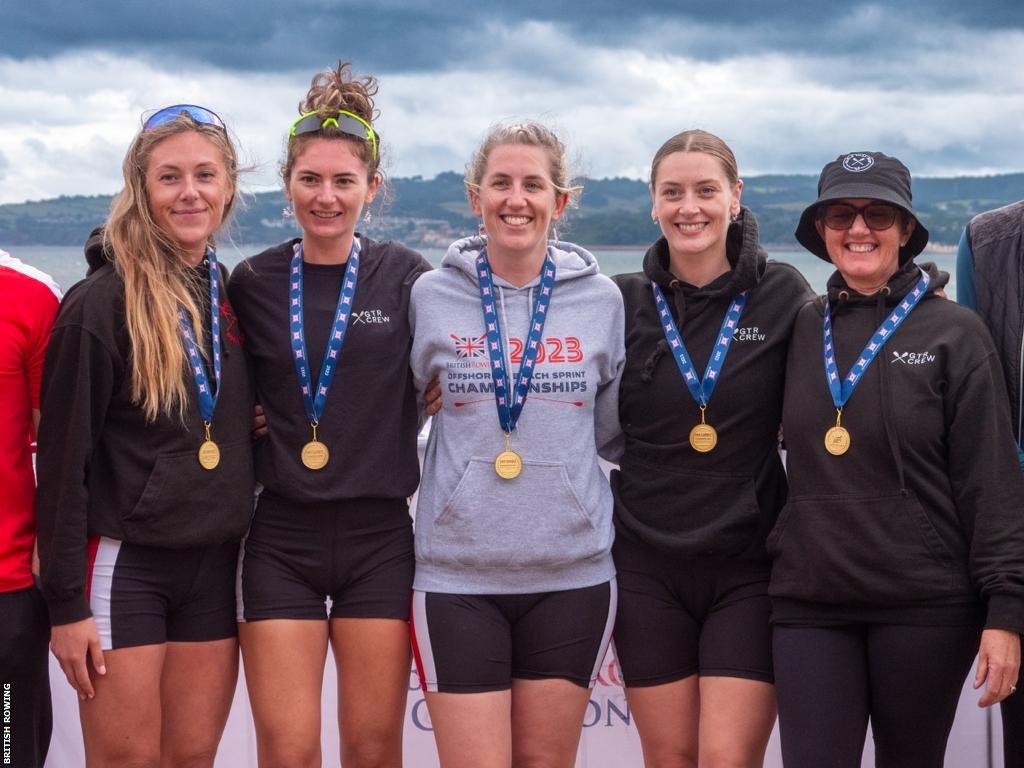 Jersey women coxless four with their gold medals