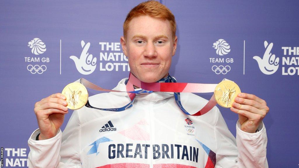 Tom Dean with the two gold medals he won at the Tokyo Olympics in 2021