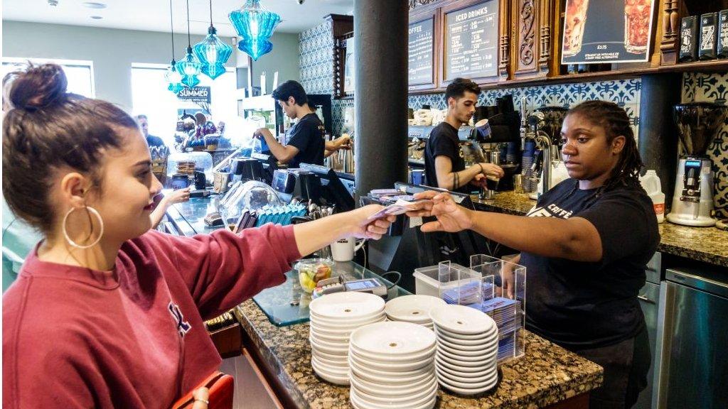 Woman working in coffee bar