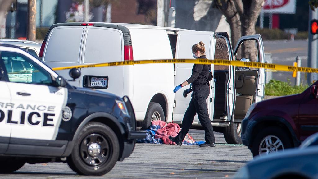 A coroner official investigates the scene of Lunar New Year mass shooting in Monterey Park.