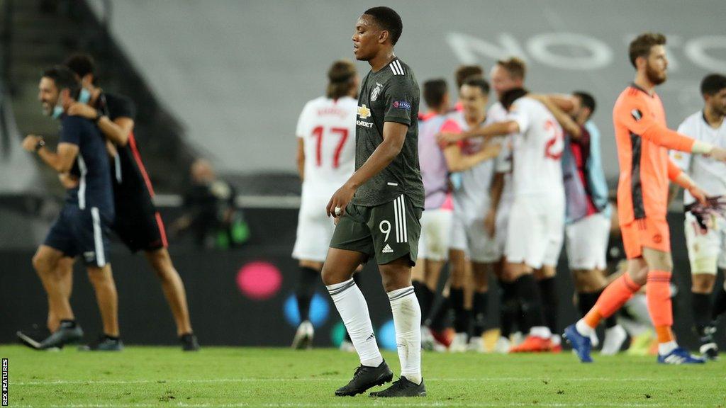 Manchester United's players react after being defeated by Sevilla in the 2020 Europa League semi-finals