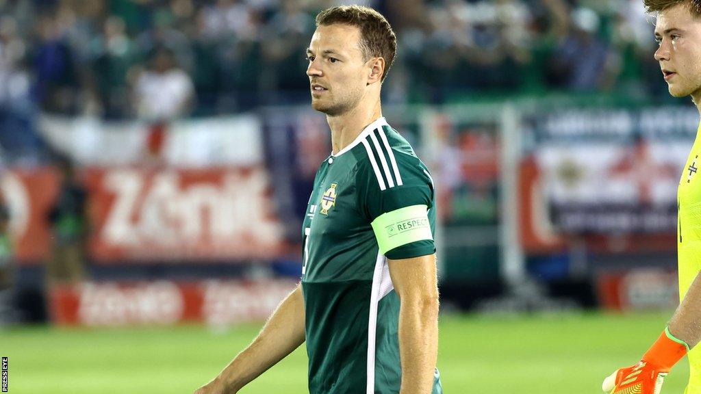 Jonny Evans leads Northern Ireland out against Greece