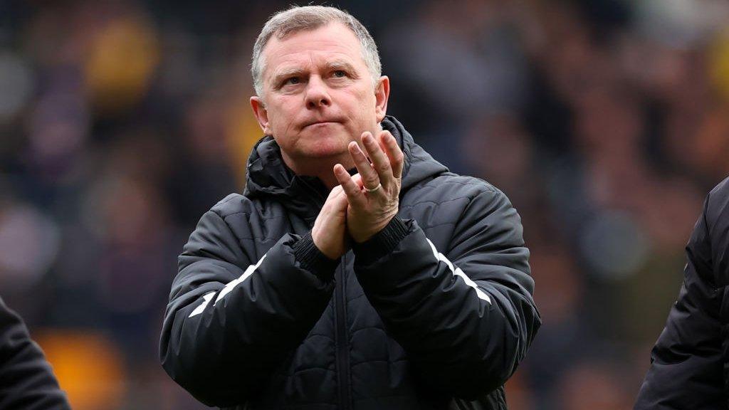 Mark Robins applauds the Coventry fans