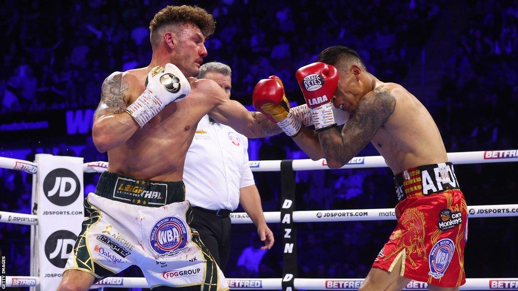 Leigh Wood lands a punch on Mauricio Lara in their first world title fight