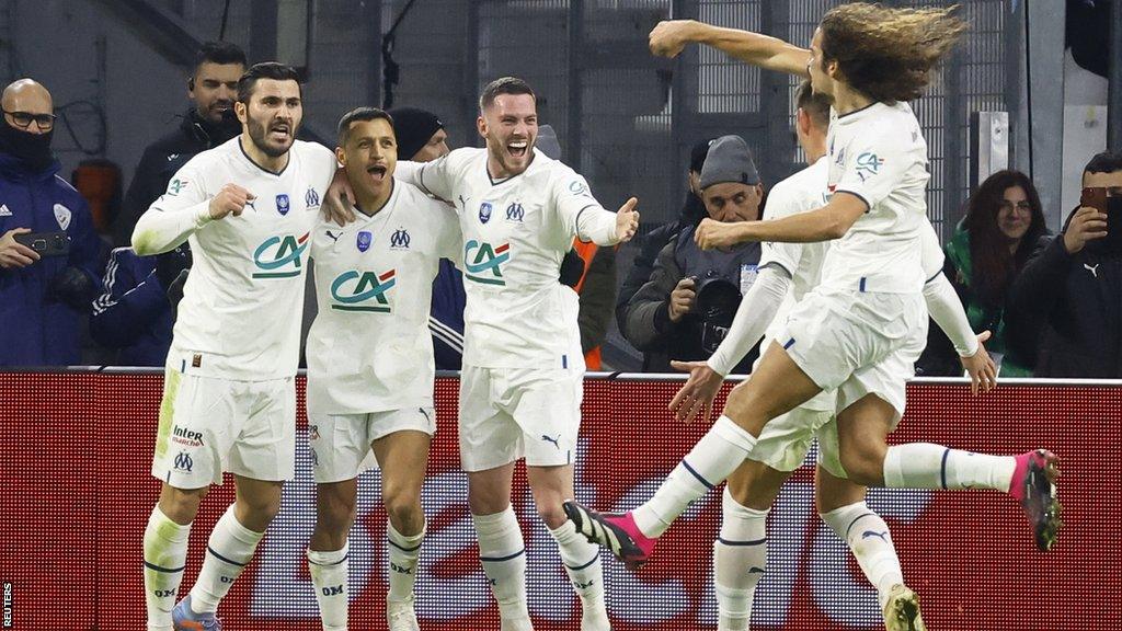 Marseille's players celebrate after scoring against Paris St-Germain in the French Cup