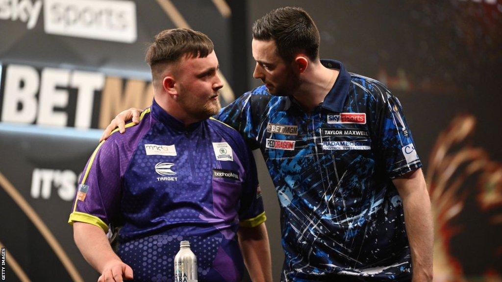 Luke Humphries and Luke Littler embrace following their Premier League Darts quarter-finals match in March