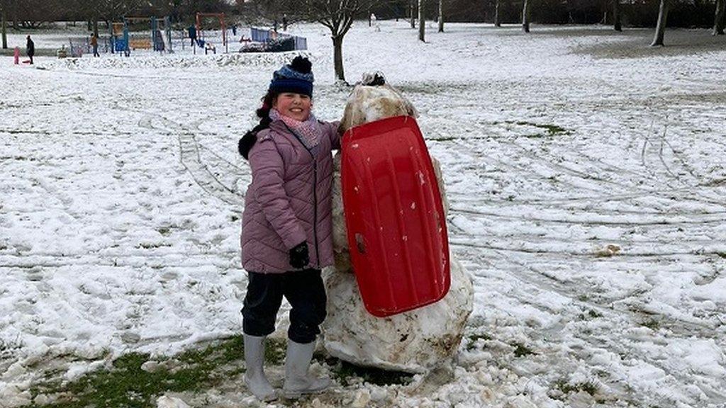 sledging snowman
