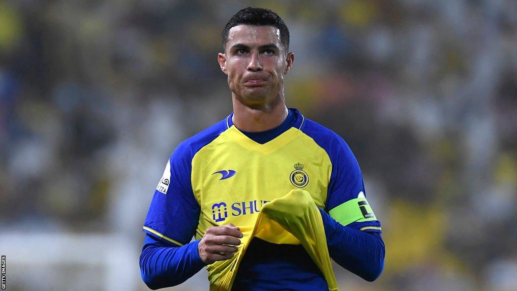 Cristiano Ronaldo, playing for Al Nassr, lifts his shirt up