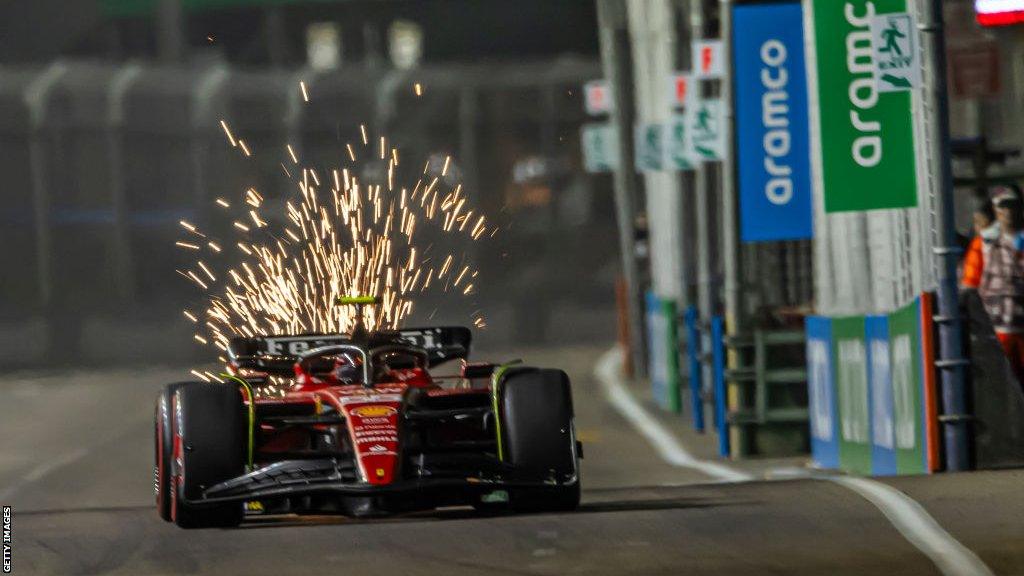 Sparks fly from the Ferrari of Carlos Sainz in Singapore