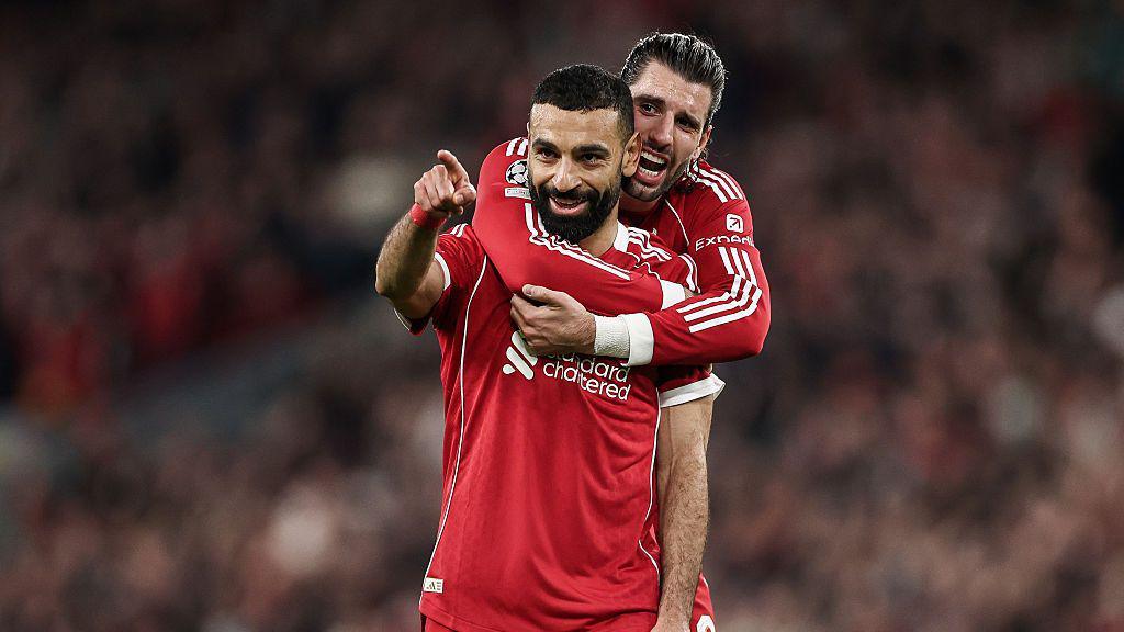 Mohamed Salah of Liverpool celebrates scoring his sides fourth goal with team mate Dominik Szoboszlai