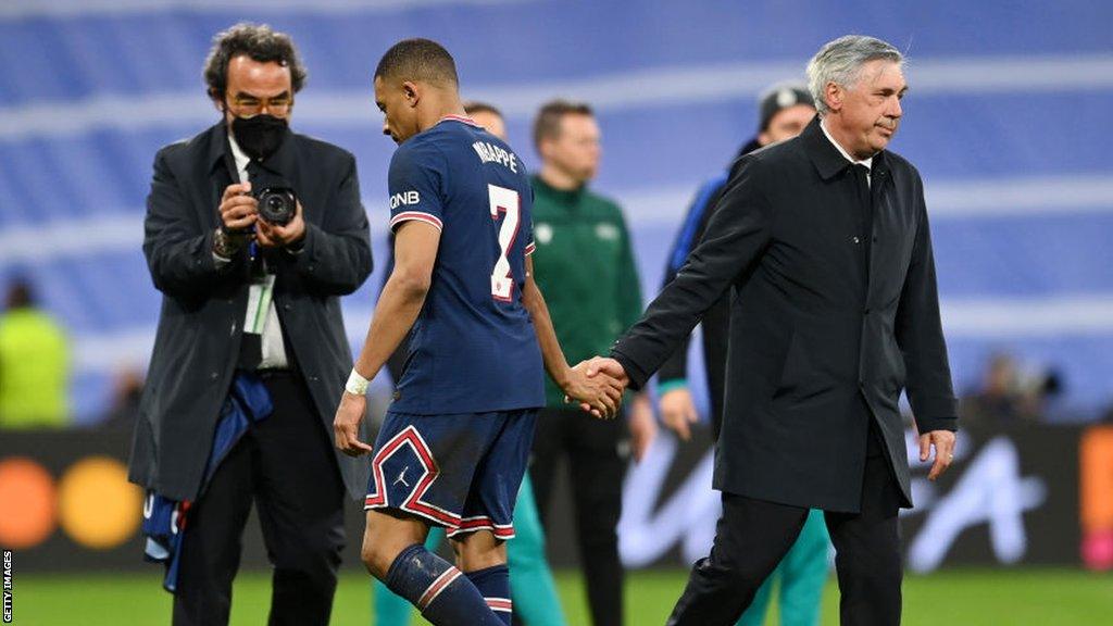 Kylian Mbappe and Real Madrid manager Carlo Ancelotti shake hands after a Champions League last 16 tie last year