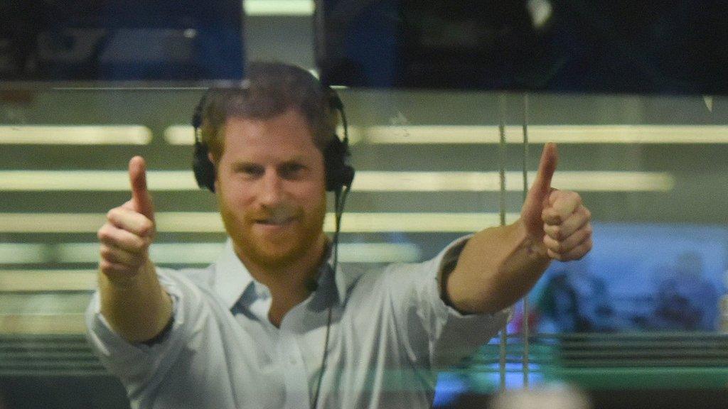 Prince Harry giving a thumbs-up gesture