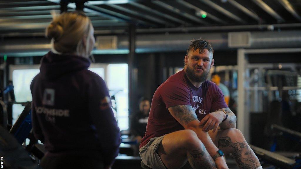 Andrew Porter in gym with sister.