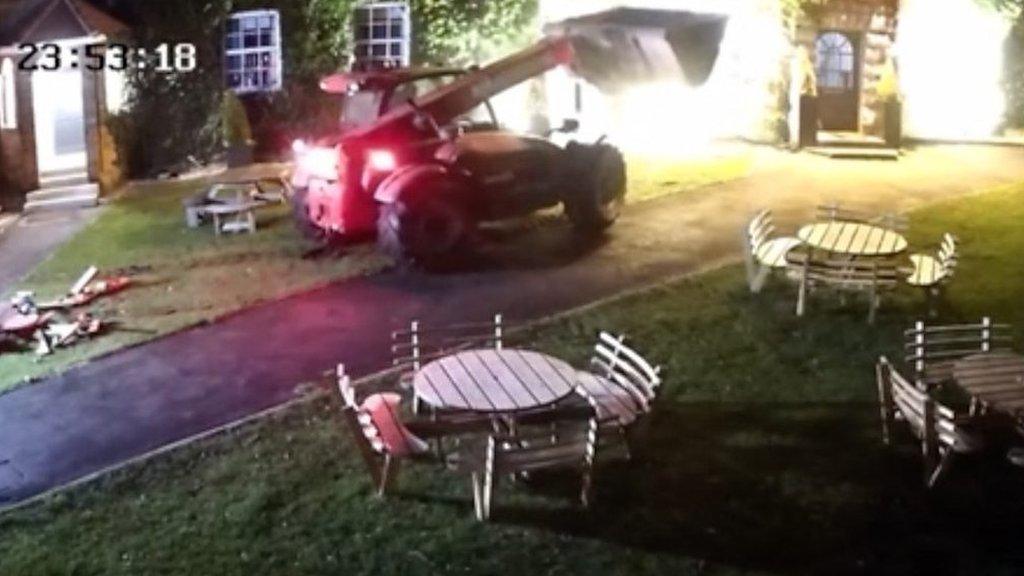 Digger rammed into pub