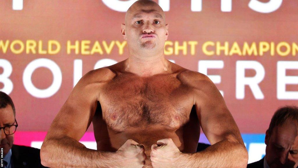 Tyson Fury flexes on the scales