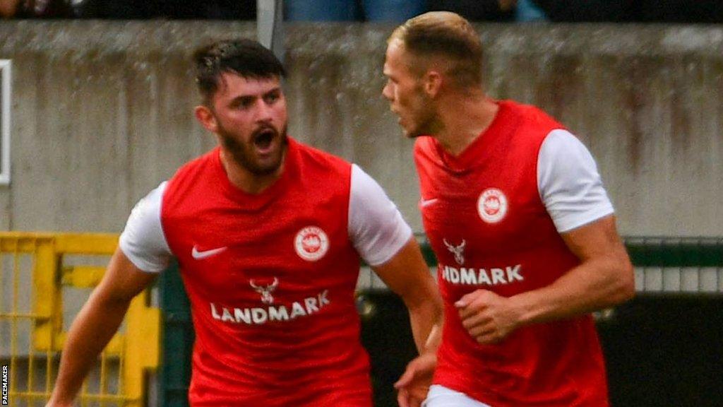 Larne goalscorer Lee Bonis receives congratulations from Leroy Millar