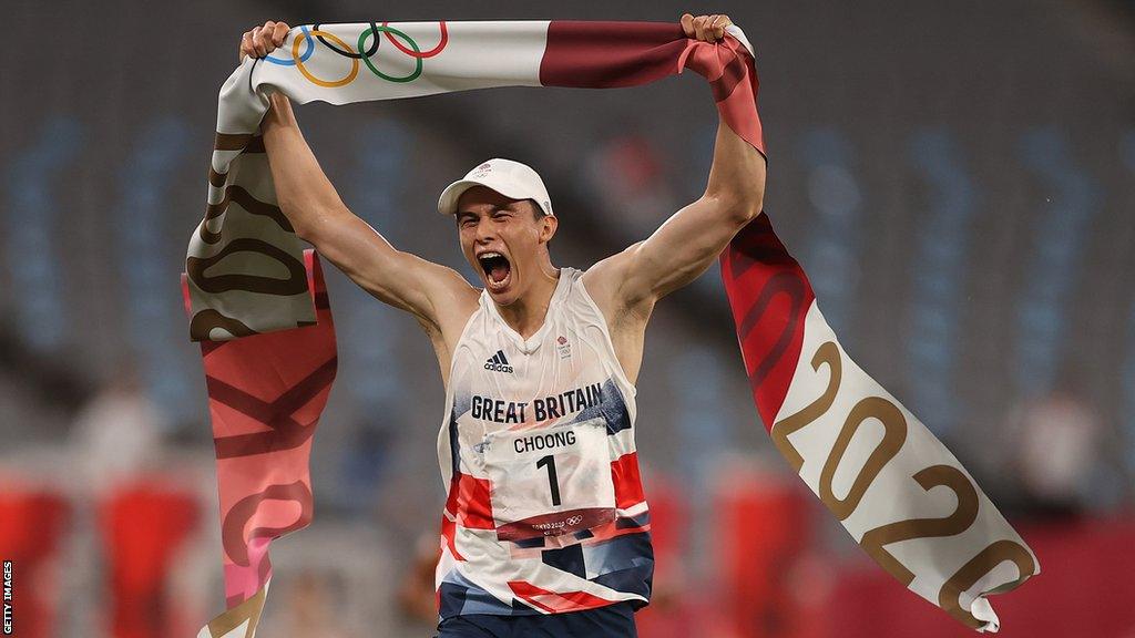 Joe Choong crosses the finish line in Tokyo