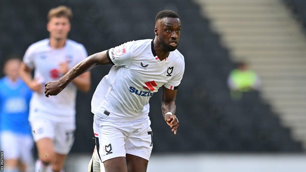 Mo Eisa in action for MK Dons