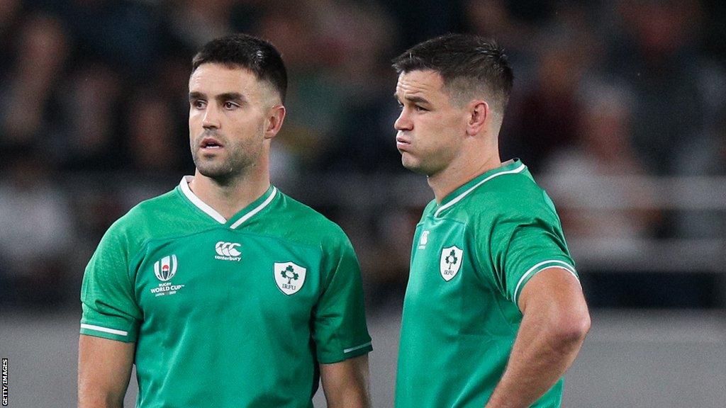 Conor Murray and Johnny Sexton look dejected after losing to New Zealand in 2019