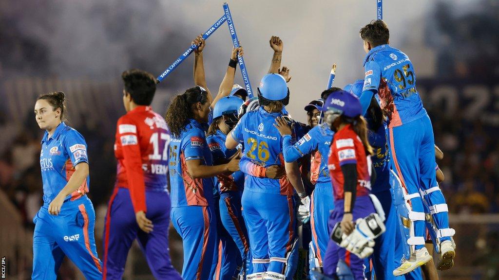 Mumbai Indians celebrate beating Delhi Capitals to win the inaugural Women's Premier League