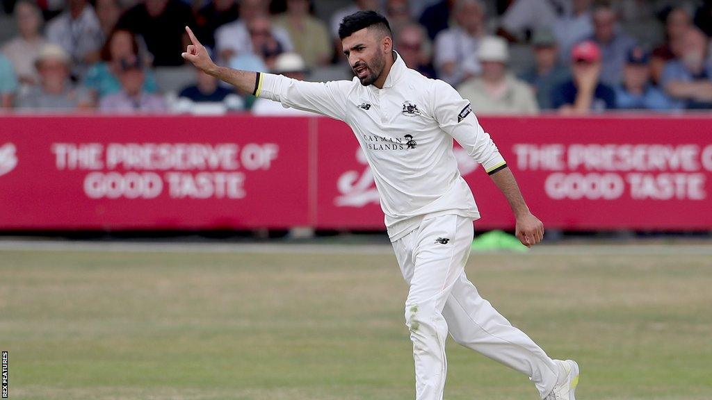 Zafar Gohar celebrates taking a wicket for Gloucestershire