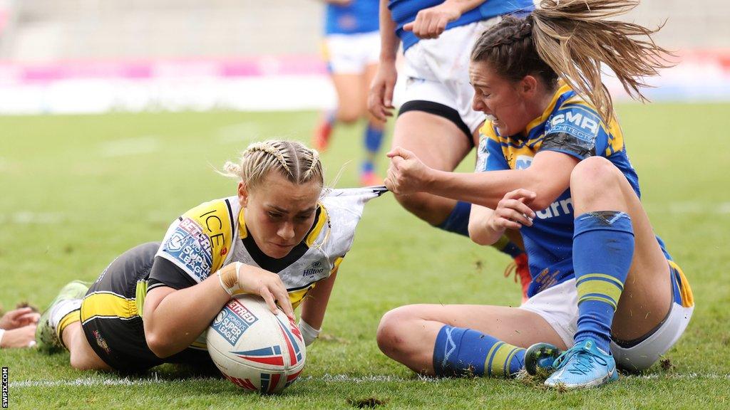 Sinead Peach scores a try for York in the Grand Final, plunging beyond Fran Goldthorp