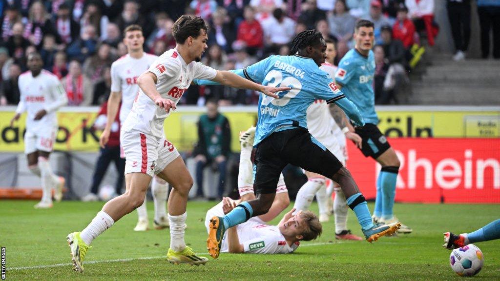 Bayer Leverkusen players take on Cologne players on Sunday