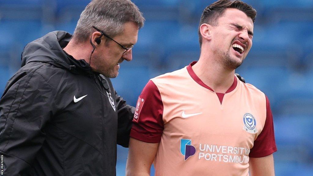 Portsmouth defender Regan Poole (right)