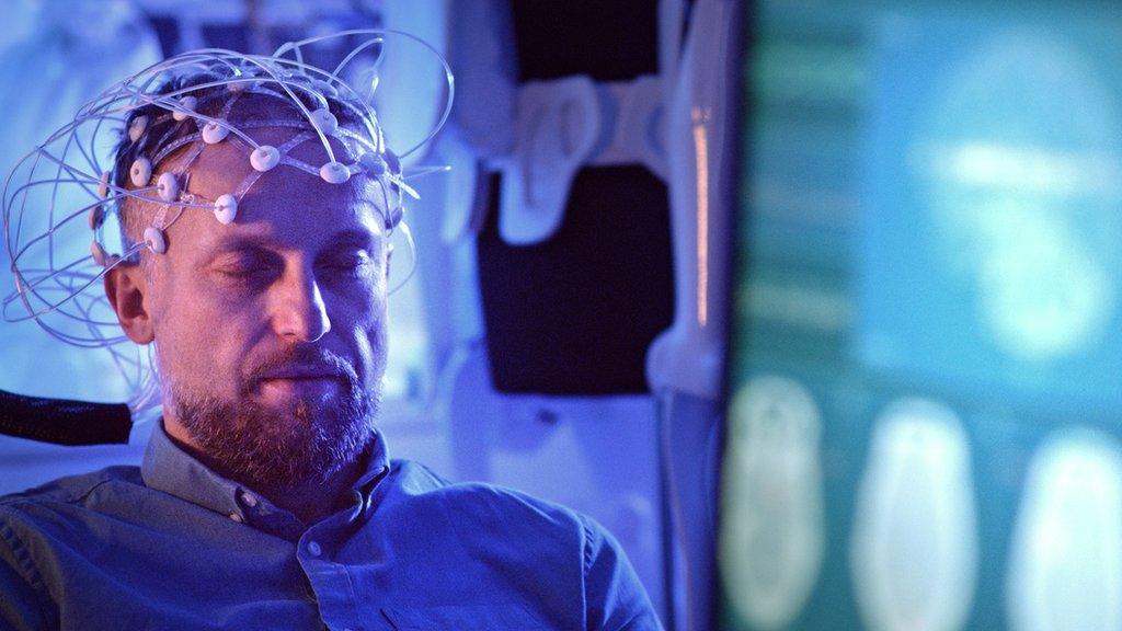 A stock image of someone having an EEG in a lab