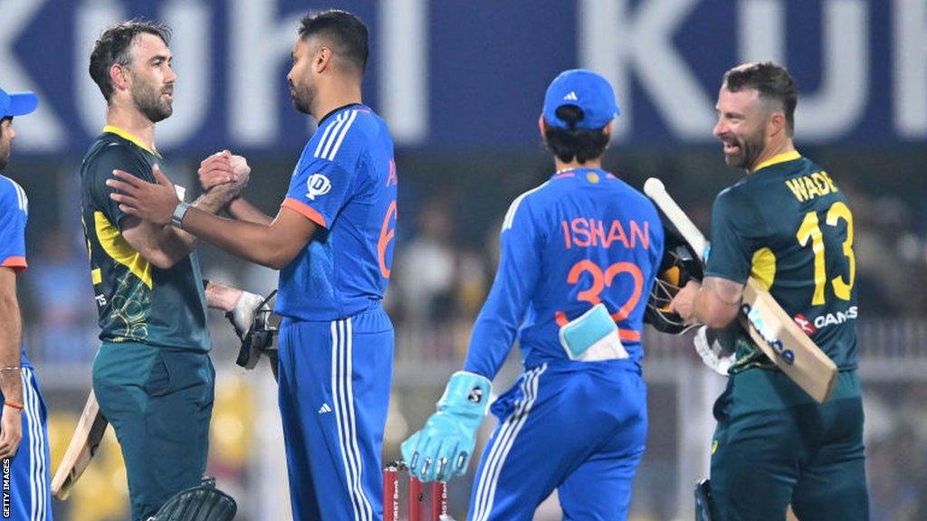 Glenn Maxwell is congratulated by India players