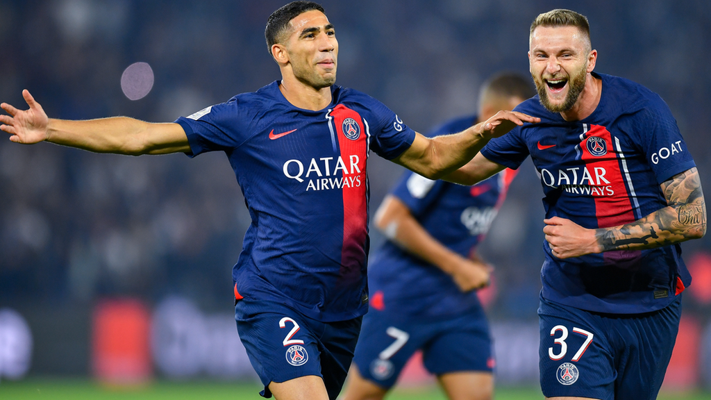 Achraf Hakimi (left) celebrates scoring for Paris St-Germain against Marseille