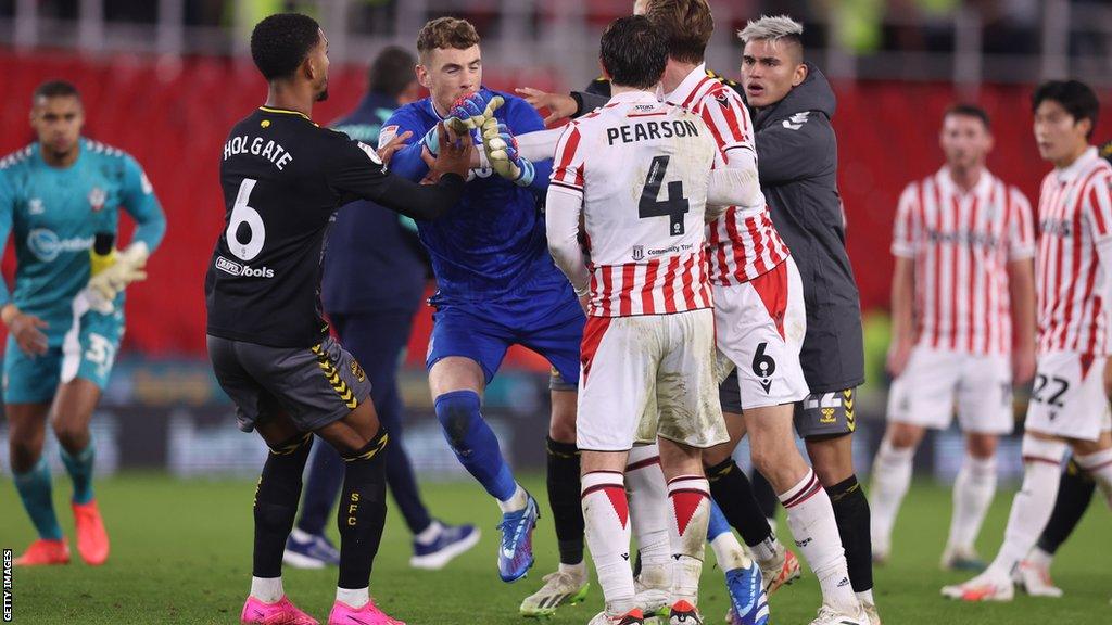 Stoke City goalkeeper Mark Travers is pushed following their Championship match with Southampton in October.