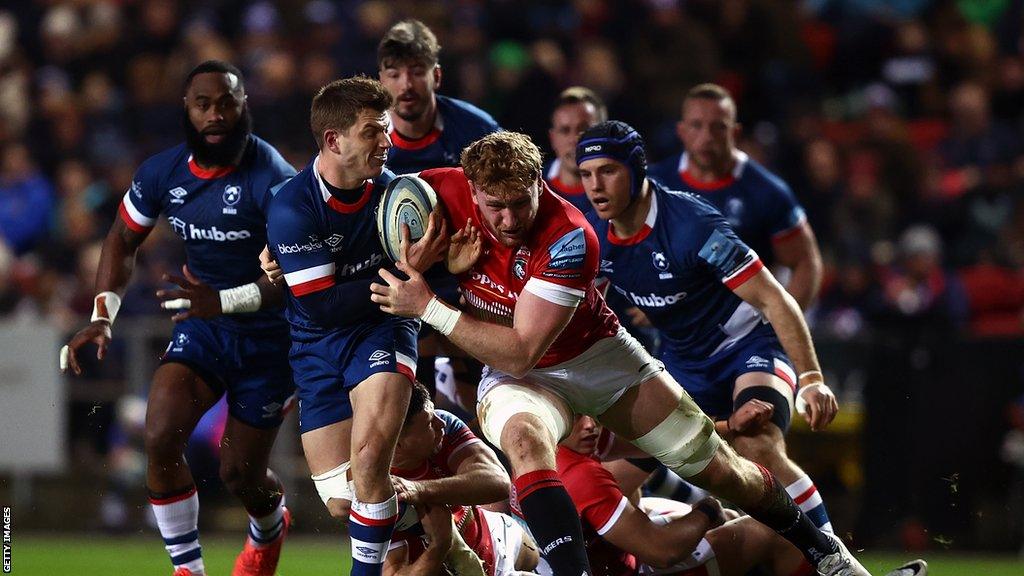 Will Porter of Bristol is tackled by Ollie Chessum of Leicester