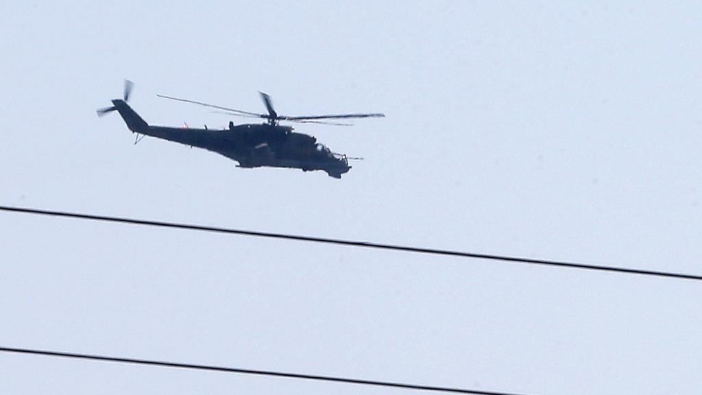 Russian helicopter hovers over Latakia airport in government-controlled coastal Syrian city. 24 September 2015