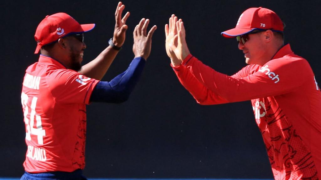 Chris Jordan (left) and Jason Roy (right) high-five after a wicket