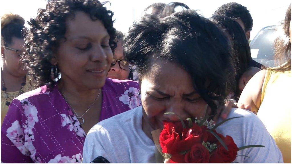 Alice Johnson (with flowers) after her release