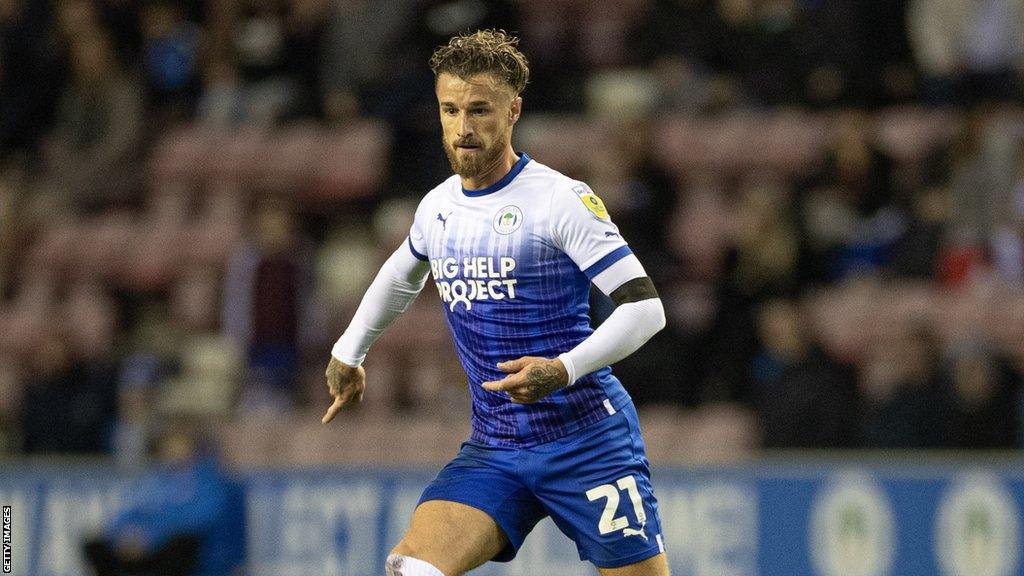 Joe Bennett runs with the ball