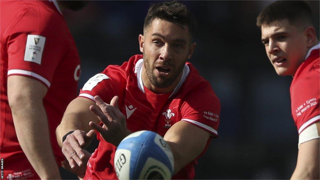 Rhys Webb gets the ball away as Joe Hawkins looks on