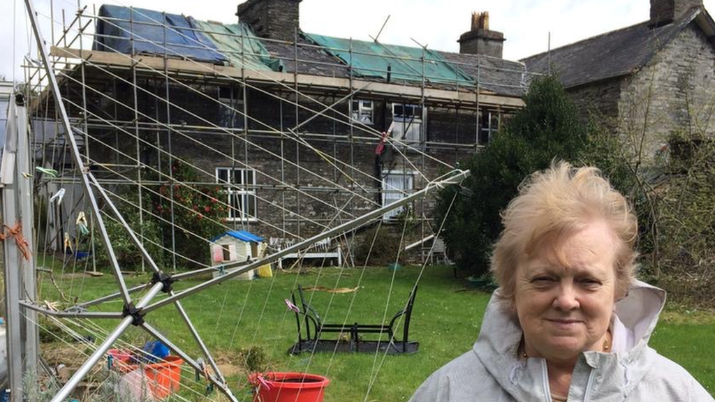 Farmer Deilwen Breese in front of her house