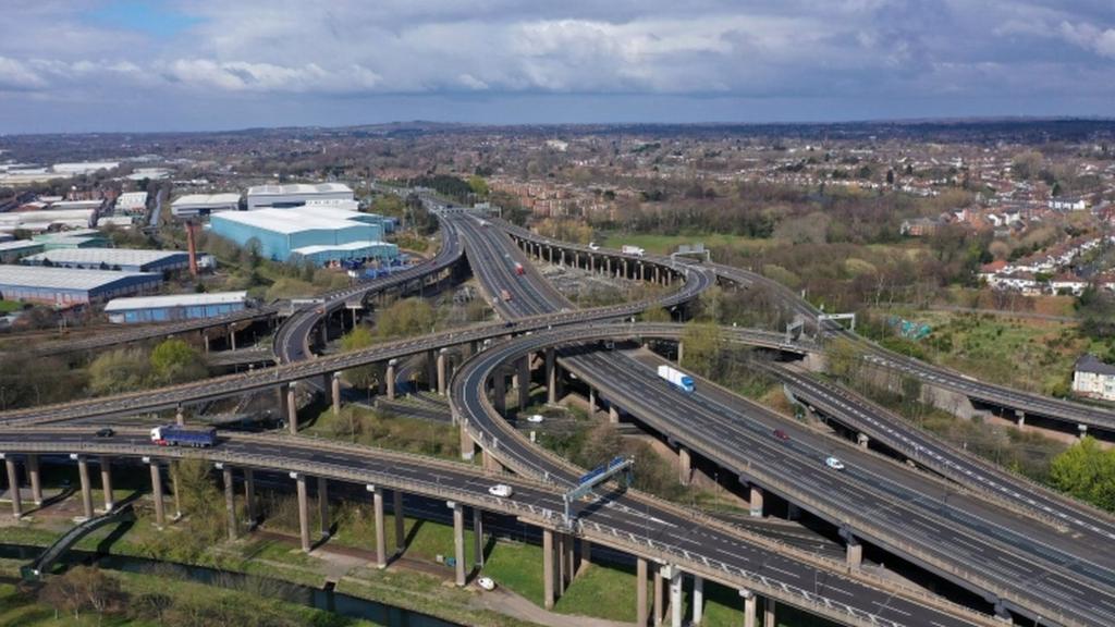 UK lockdown - Traffic moves through Gravelly Hill Interchange, junction 6 of the M6 motorway where it meets the A38 Aston Expressway