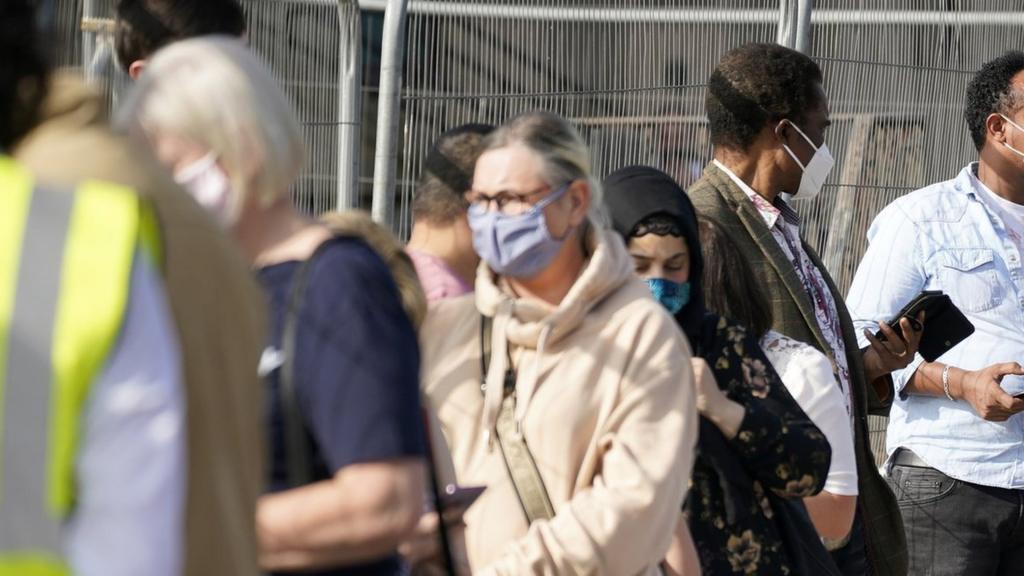 People queue at a walk in Covid-19 testing centre on September 17, 2020 in Bolton, England.