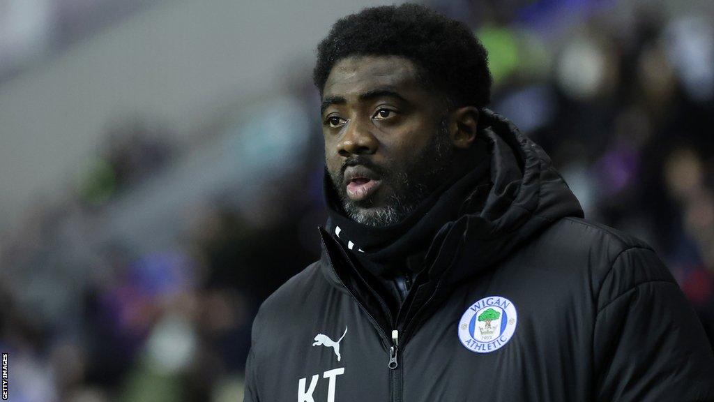 Sacked Wigan boss Kolo Toure looks on from the touchline