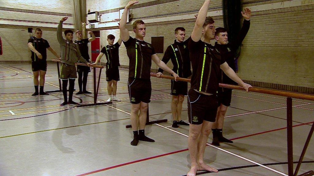 Rugby team doing ballet