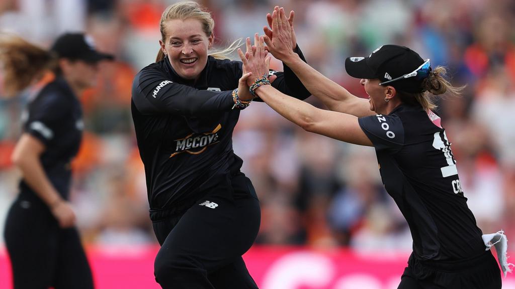 Manchester Originals players Sophie Ecclestone (left) and Kate Cross (right) celebrate a wicket