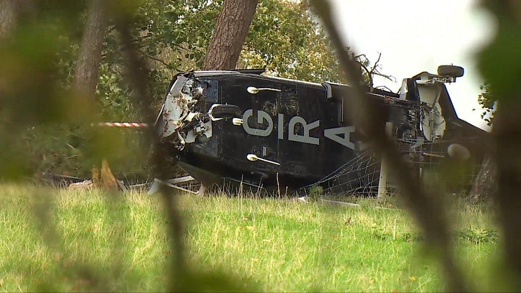 crashed helicopter body in a forest