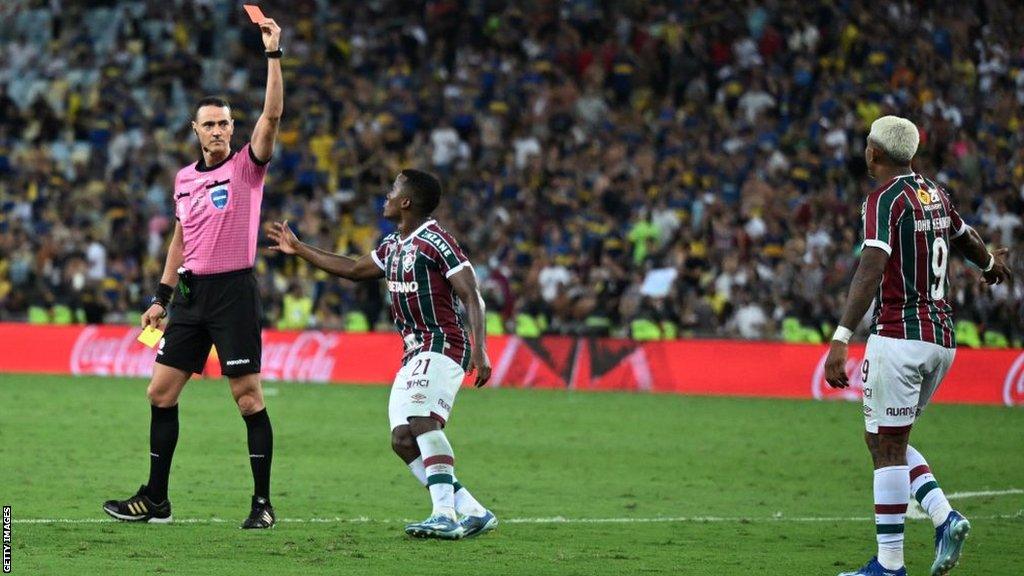 John Kennedy is shown a red card