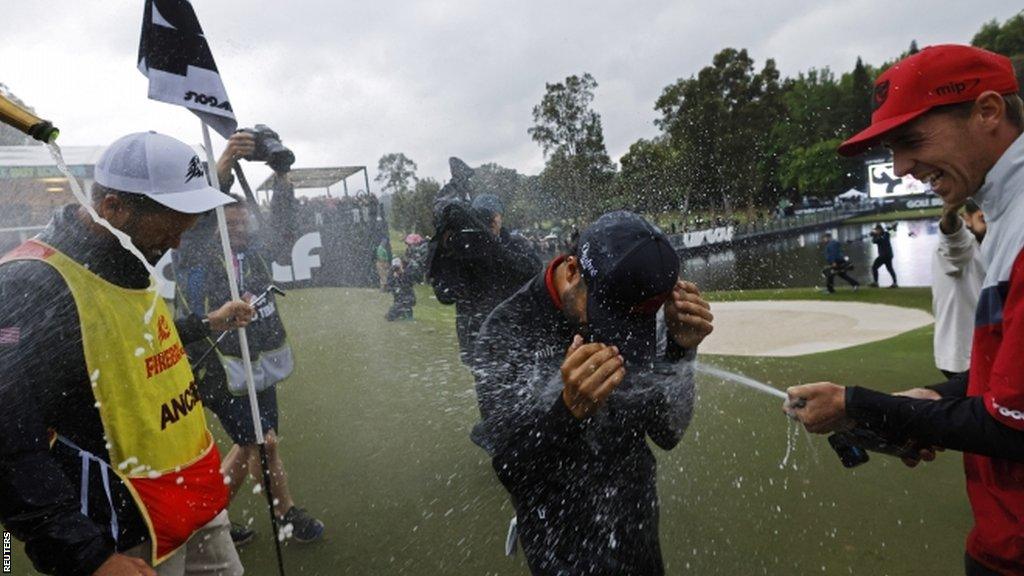 Abraham Ancer is sprayed with champagne after winning LIV Golf Hong Kong