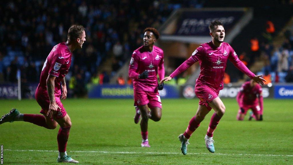 Swansea player Liam Cullen celebrates a goal