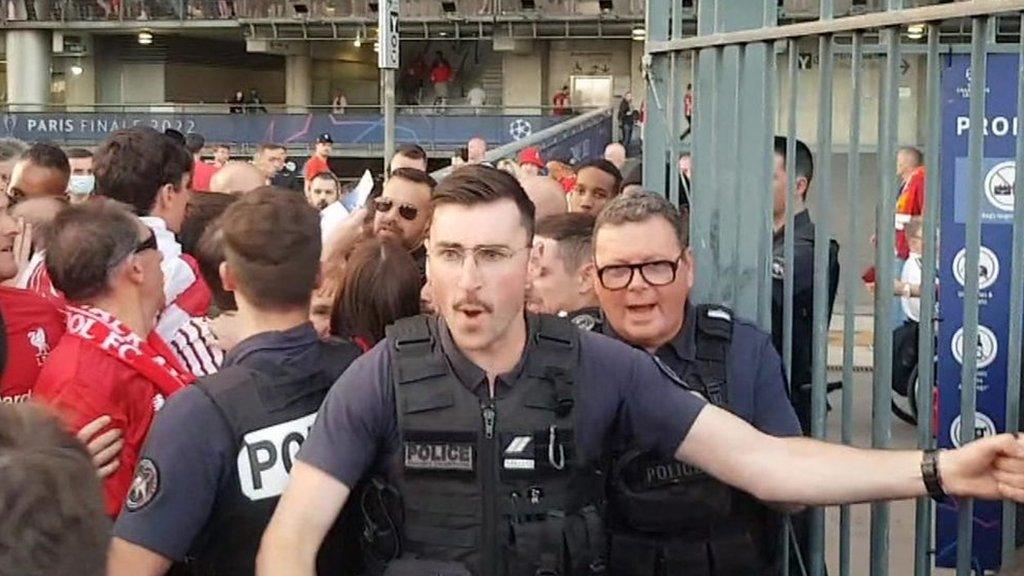 A police officer by the stadium gate